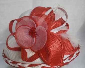 Adorn yourself with elegance in our exquisite handcrafted red and white flowered hat.