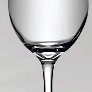 May include: A clear, stemmed wine glass with a rounded bowl and a slender stem. The glass is made of transparent material, reflecting light and creating highlights. The design is simple and elegant, suitable for serving wine.