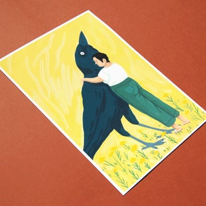 May include: A black bird with a person hugging it from behind. The bird is standing on a yellow field with green grass and yellow flowers. The person is wearing blue jeans and a white shirt.