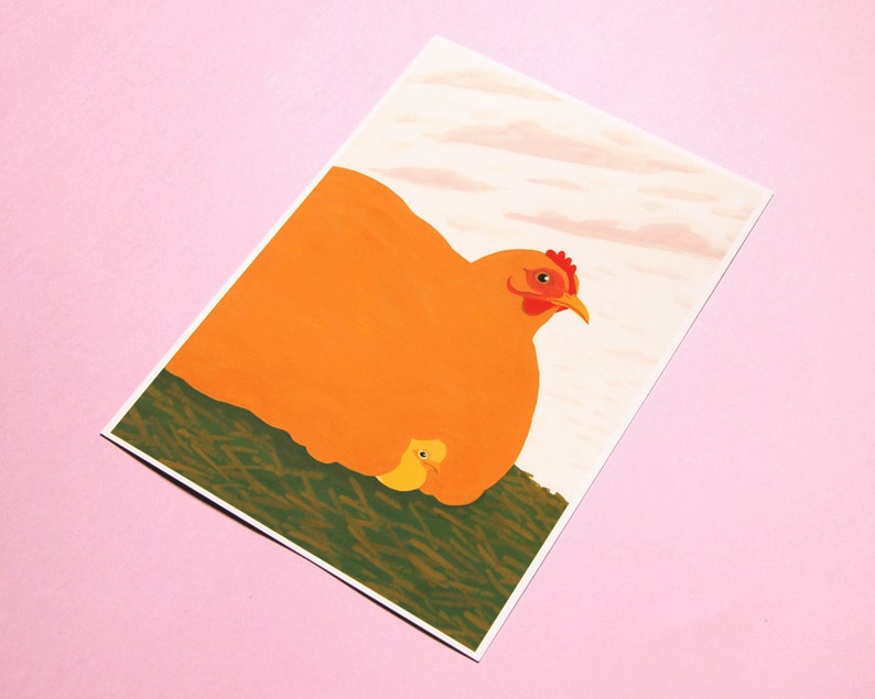 May include: A close-up of a mother hen and her chick. The hen is orange and has a red comb. The chick is yellow and is nestled under the hen's wing. The background is a light pink.