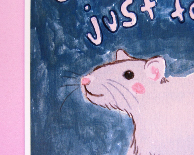 May include: A watercolor painting of a pink rat with a blue background. The rat is looking to the right and has a pink nose and pink ears. The text "Just Rat" is written in pink letters on the top of the image.