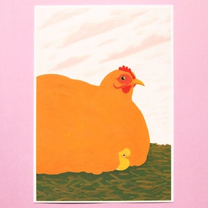 May include: A large orange chicken with a red comb and beak is sitting on a bed of green grass. A smaller yellow chick is nestled under the chicken's wing.
