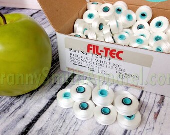 Magnetic core bobbins. Fil-Tec Magna-Glide Classic Embroidery Machine prewound Bobbins. Type / Class / Style L. Filament Polyester No. 60