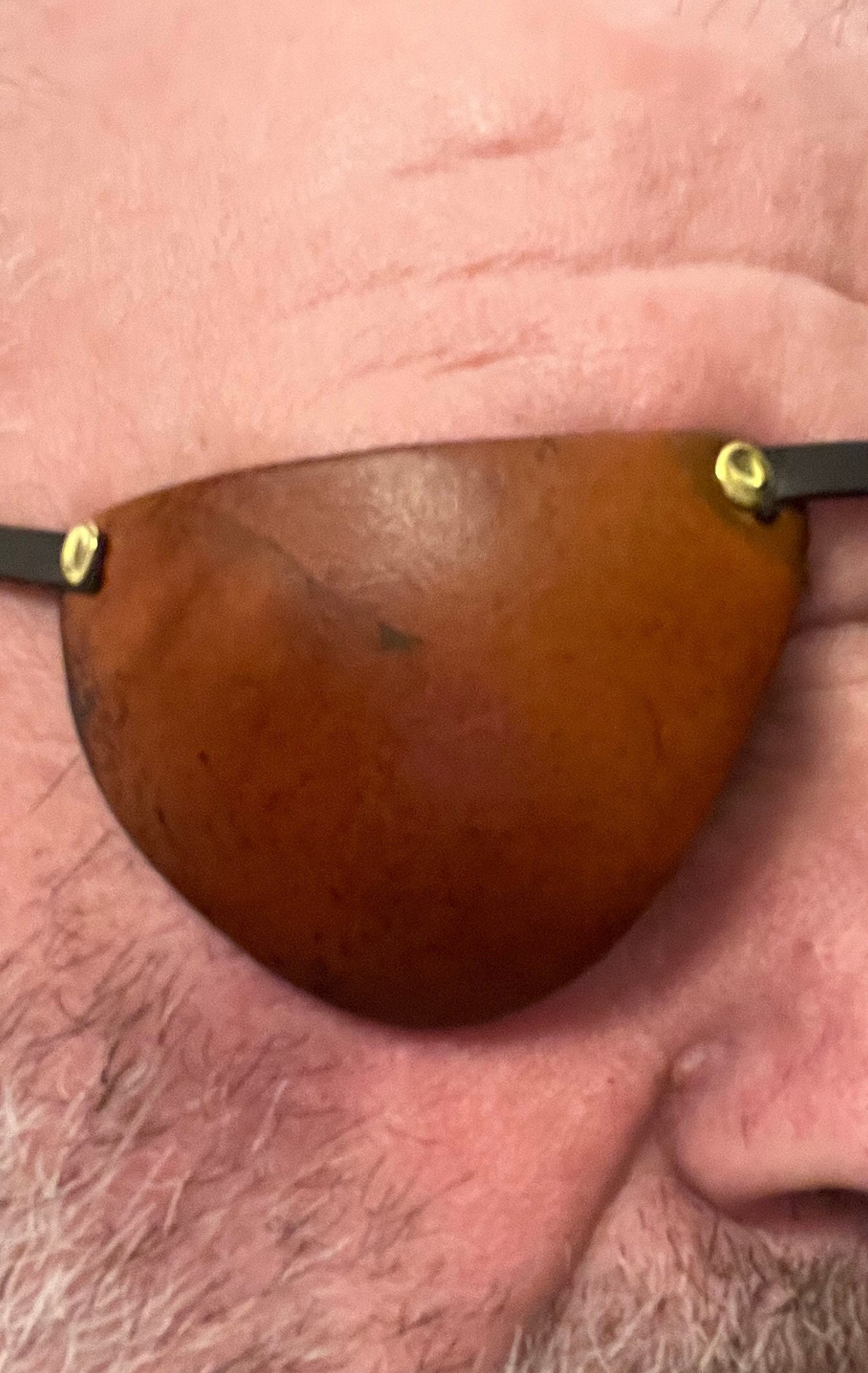 Leather, handmade eyepatch with riveted flat straps and buckle fitting