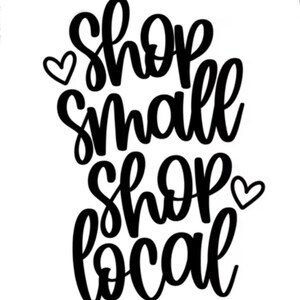 May include: A black and white graphic featuring the text "Shop Small Shop Local" in a cursive font, with two heart symbols. The design is set against a plain white background.