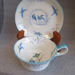 Taza de té y plato pintados a mano de Jackson Gosling, GROSVENOR CHINA, de estilo inglés antiguo, con detalles en turquesa, circa 1900