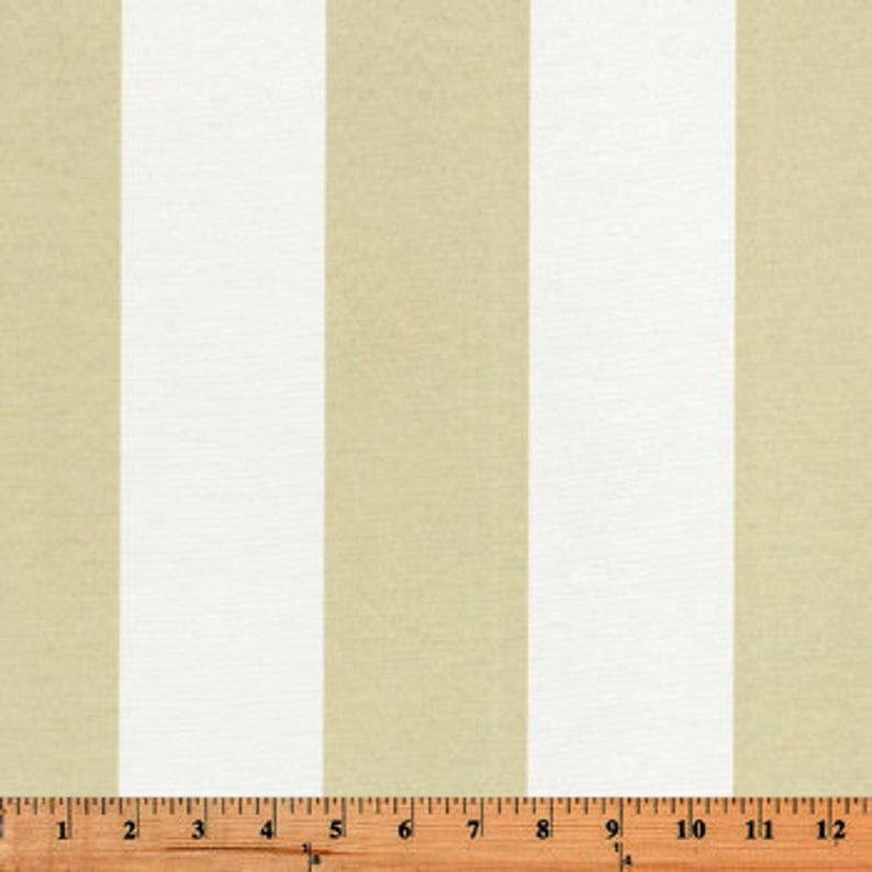 May include: Beige and white striped fabric with a repeating pattern. The fabric is woven and has a subtle texture.