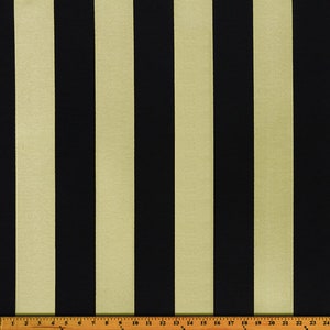 May include: Black and beige striped fabric with a ruler measuring 24 inches.