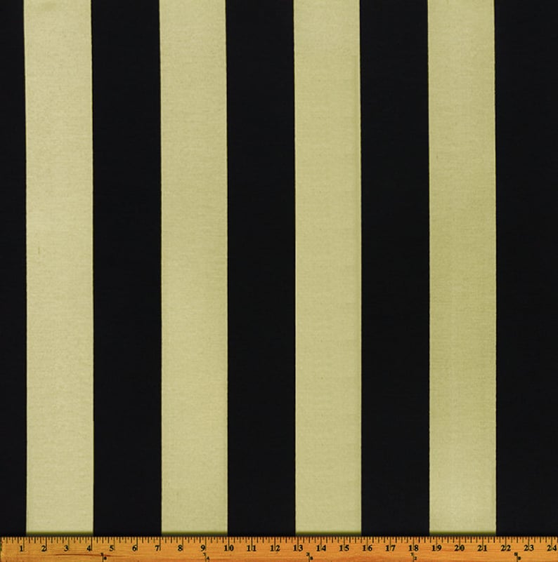 May include: Black and beige striped fabric with a ruler measuring 24 inches.