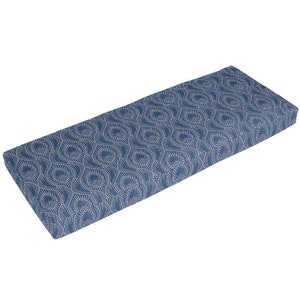 May include: A blue and white patterned bench cushion with a geometric design.