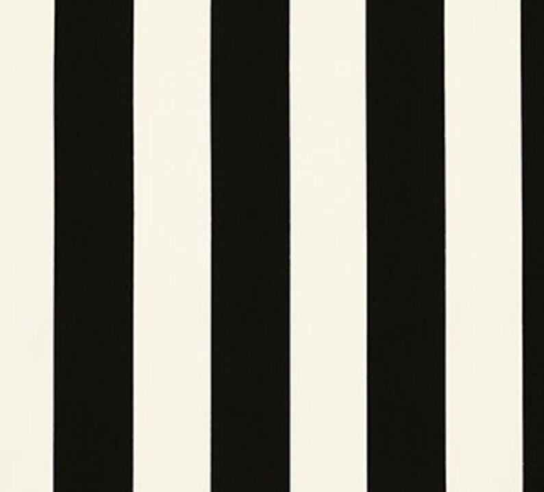 May include: Black and white striped fabric with vertical stripes.