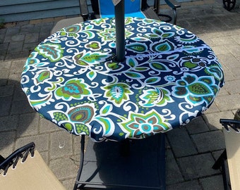 Round fitted tablecloth with 2" Umbrella Hole and zipper for easy application and removal, washable, outdoor use only