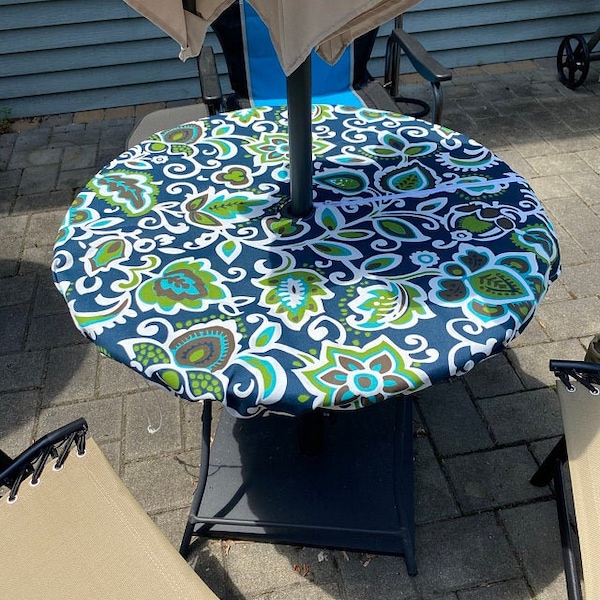 Round fitted tablecloth with 2" Umbrella Hole and zipper for easy application and removal, washable, outdoor use only