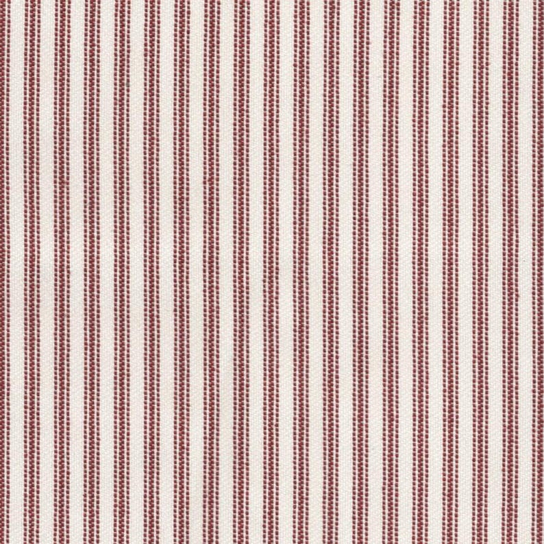 May include: A woven fabric featuring a repeating pattern of vertical stripes in deep red and off-white. The design consists of thin, solid red lines alternating with wider bands composed of multiple closely spaced, dotted red vertical lines.