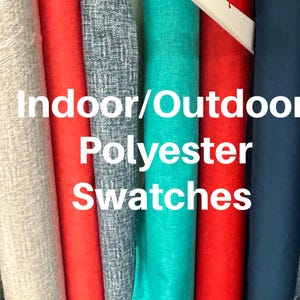 May include: A collection of vertical fabric rolls in various colors including light gray, red, dark gray with a white pattern, teal, and navy blue. The text "Indoor/Outdoor Polyester Swatches" is overlaid on the center of the fabric rolls.
