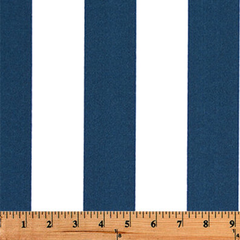 May include: White and navy blue striped fabric. The fabric has a vertical stripe pattern.