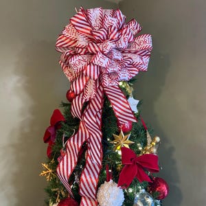 Wit rode snoepgoed kerstboomtopper strik met slingers, kerstkransstrik, strik voor volants, trap of grote geschenken. Noordpool