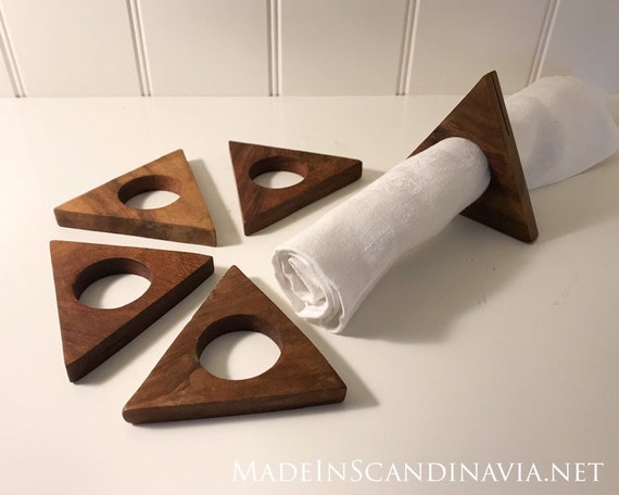 Mid-century collection of 5 triangular teak napkin rings and place setting holders