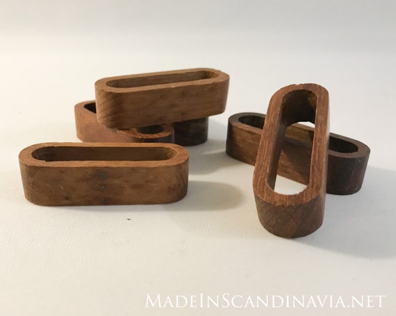 Mid-century collection of 5 teak napkin rings