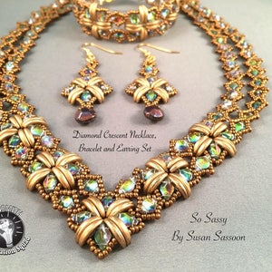 May include: A gold beaded necklace, bracelet, and earrings set with a diamond crescent design. The jewelry is made with iridescent beads and gold-toned metal.