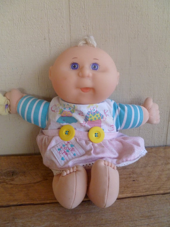cabbage patch kid with violet eyes