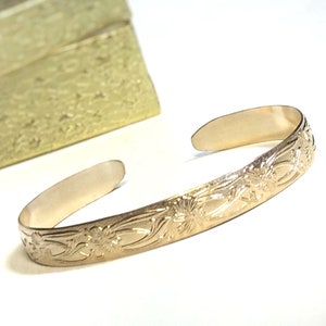 14k Gold filled cuff bracelet, Cuff with flower and vine pattern, Gold stacking bracelet for a an average size wrist, gold jewelry gift.
