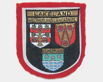 Vintage 1970s Lakeland Fabric Patch - Lake District Cumberland Lancashire Westmorland England English souvenir travel red black gold 1980s