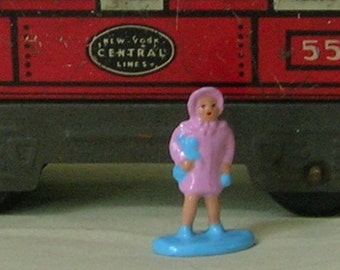 Little girl in pink coat, O scale model railroad train layout, hand-painted reproduction of vintage toy figure