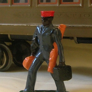 Platform Porter carrying luggage, Standard Gauge model train station layout, hand-painted reproduction of vintage figure