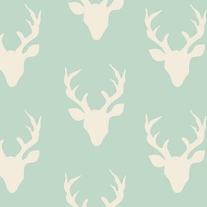 May include: A seamless pattern featuring white silhouettes of deer heads with antlers on a light blue background.