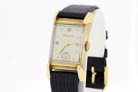 Solid gold bulova best sale watch