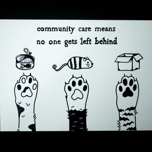 May include: A black and white illustration on a white background. The text reads "community care means no one gets left behind." The image includes a can of tuna, a toy mouse, and a cardboard box above three cat paws.