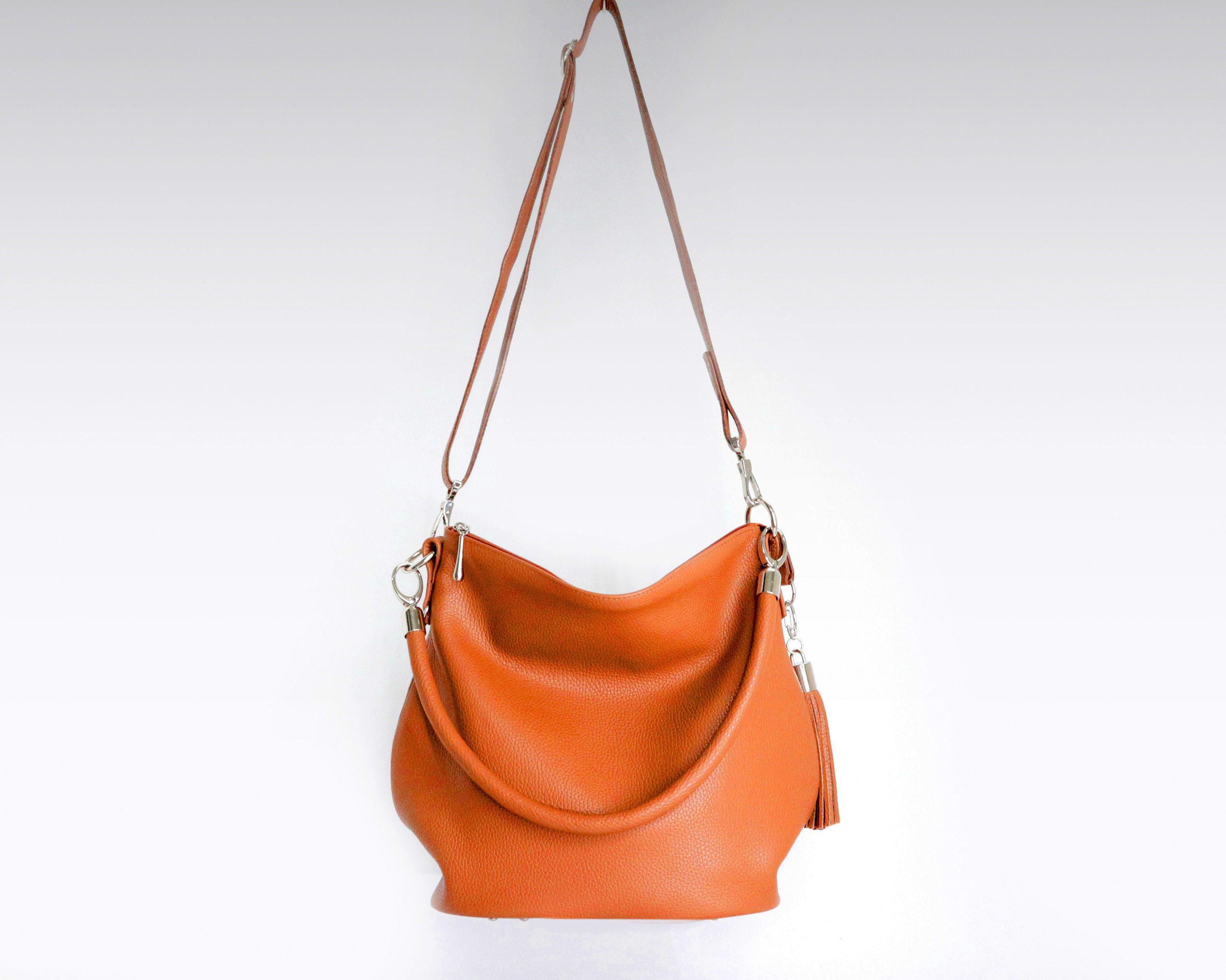 Leather purse Louis Vuitton Orange in Leather - 31534628