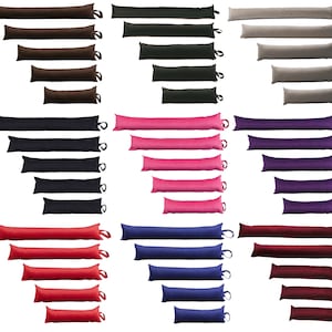 May include: Set of 10 door draught stoppers in various colours, including brown, black, grey, pink, purple, red, blue, and burgundy. Each stopper is a long, rectangular shape with a loop at one end.