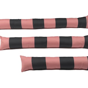 May include: Three door draught excluders in different sizes, with pink and black stripes. The excluders are made of fabric and have a loop at one end.