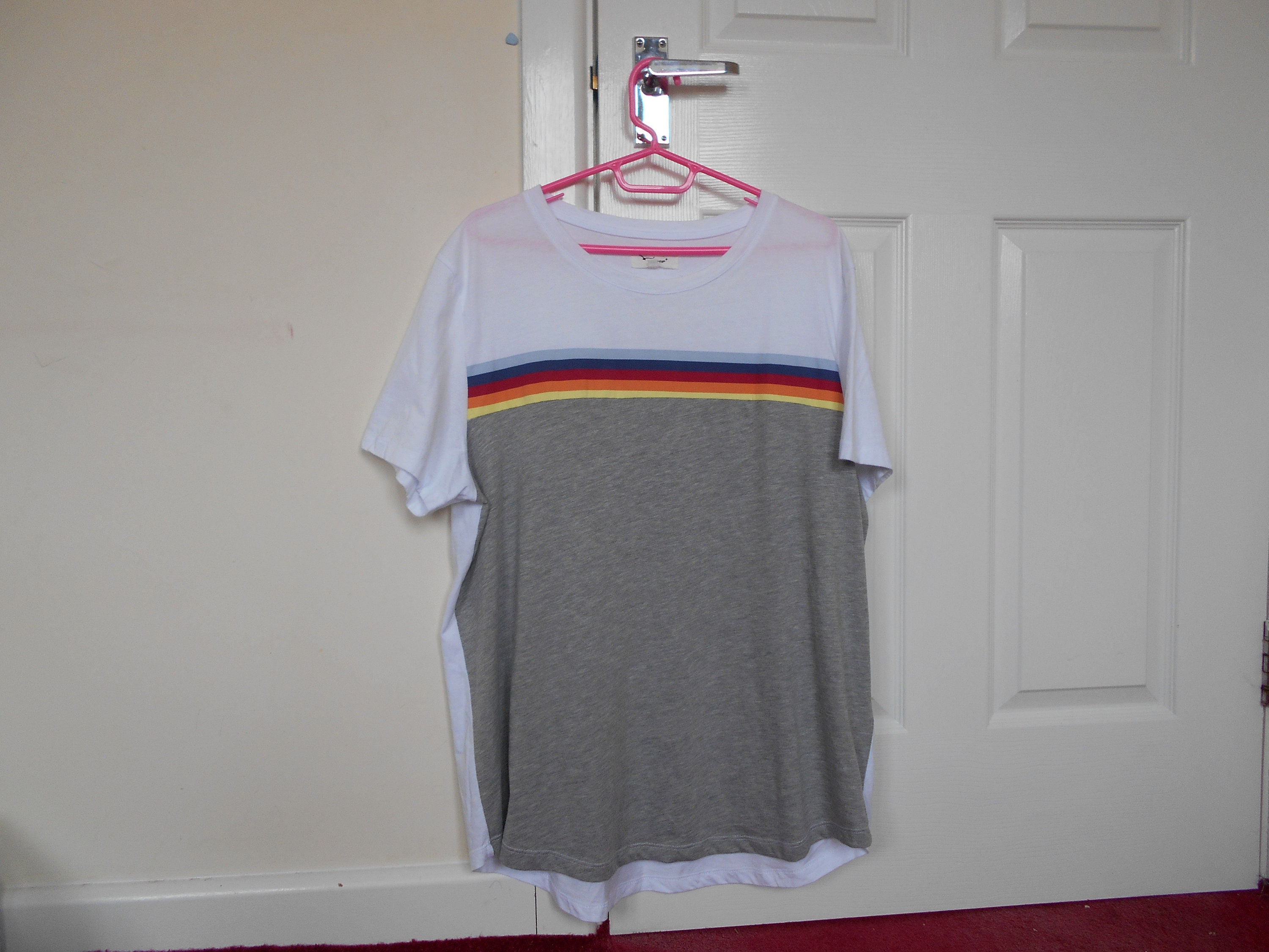 grey shirt with rainbow stripe