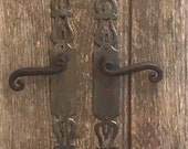 A pair of rustic chippy vintage French solid metal doorhandles and thier original fingerplates architectural salvage