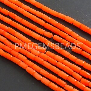 May include: Multiple strands of bright orange cylindrical beads arranged in parallel lines. Each bead has a smooth, uniform shape and is strung together. The text PMEGEMSBEADS is overlaid in white across the center of the orange bead strands.