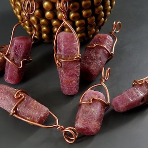 May include: A set of three ceramic mugs with a speckled, matte finish in cream, light grey, and dark grey. Each mug has a simple, minimalist design, ideal for tea or coffee.