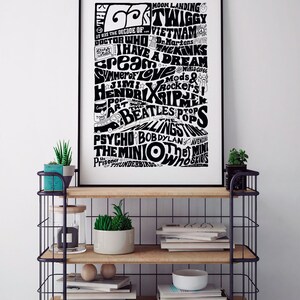 May include: Black and white typography poster with the text "The 60s" and a list of events, people, and cultural icons from the 1960s, including "Moon Landing", "Twiggy", "Vietnam", "Dr. Martens", "I Have A Dream", "Cream", "Summer of Love", "Jimi Hendrix", "The Beatles", "Bob Dylan", "The Mini", and "The Avengers".