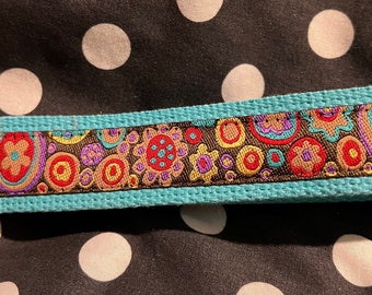 KEY FOB.....Floral themed 1.5” Wide High End Woven Ribbon sewn on a thick Turquoise Cotton Webbing.  Great Inexpensive Gift Idea!