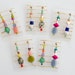 see more listings in the EARRINGS - DANGLE section