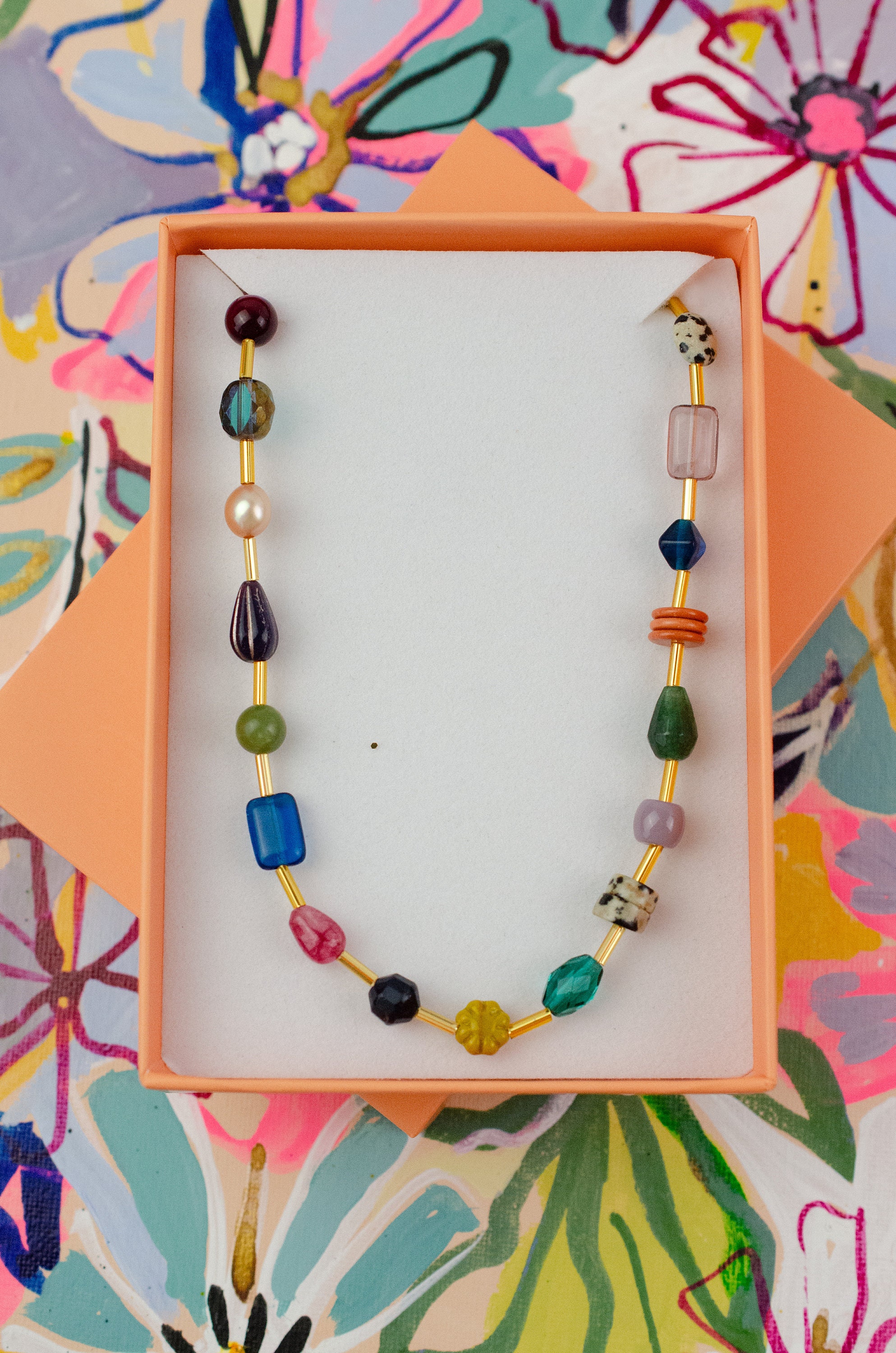 Colorful beaded friendship necklace with flower motif