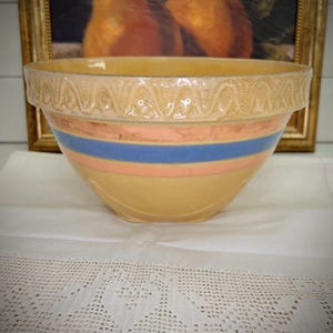 Vintage McCoy pottery bowl, yellow ware bowl, pink and blue stripe mixing bowl