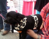 Very cute black w cheetah fleece print collar and belt and black fleece lining. The handmade coat is quality with attention to detail.