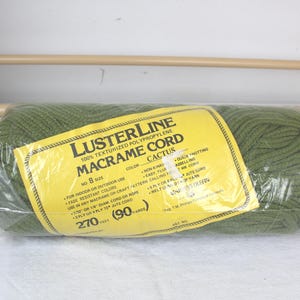 May include: A roll of Lusterline Macrame Cord in Cactus color, size 8. The label indicates it is 100% textured polypropylene, suitable for indoor or outdoor use. The roll contains 270 feet (90 yards) of cord.