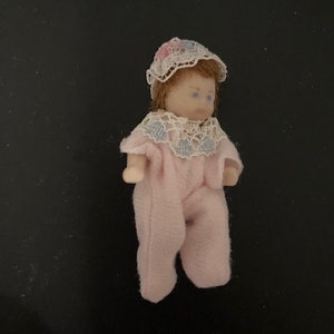 Porcelain baby girl with lace cap. Vintage