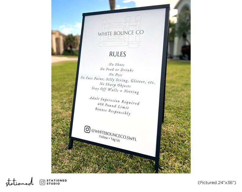 May include: A black metal A-frame sign with a white board displaying the text WHITE BOUNCE CO, RULES, No Shoes, No Food or Drinks, No Pets, No Face Paint, Silly String, Glitter, etc., No Sharp Objects, Stay Off Walls + Netting, Adult Supervision Required, 400 Pound Limit, Bounce Responsibly, and @WHITEBOUNCECO.SWFL. The sign measures 24 inches by 36 inches.