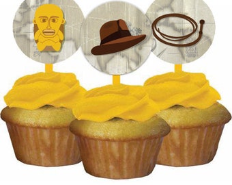May include: Three yellow frosted cupcakes with brown and white round toppers. The toppers feature an image of a man with a hat, a whip, and a map.