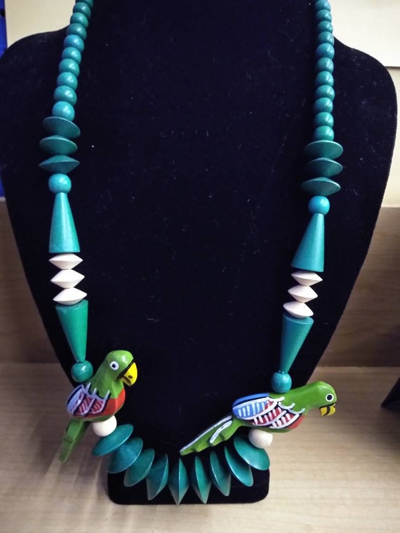 Wood beaded necklace with hand carved parrot figur